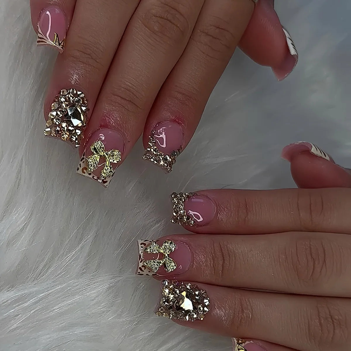 Dusty Pink French Tip Nails with Gold Glitter, Bows and Rhinestones
