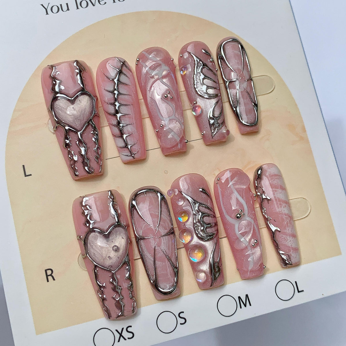 Dusty Pink Marble Press On Nails With Silver Chrome Hearts, Wings and Rhinestones