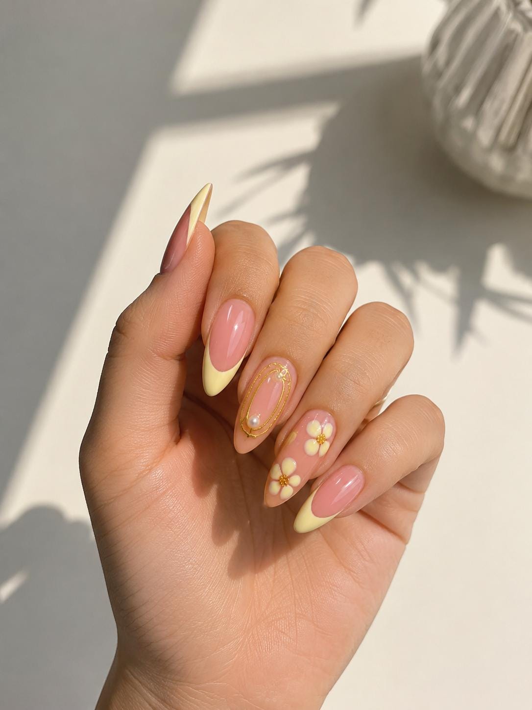 Dusty Pink Nails With Pale Yellow French Tips, Daisies, and Gold Details for Spring and Summer