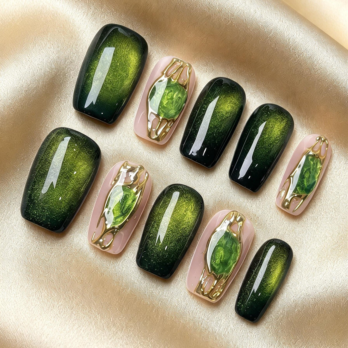 Emerald Green Cat Eye Nails With Gemstone Accents and Gold Frames
