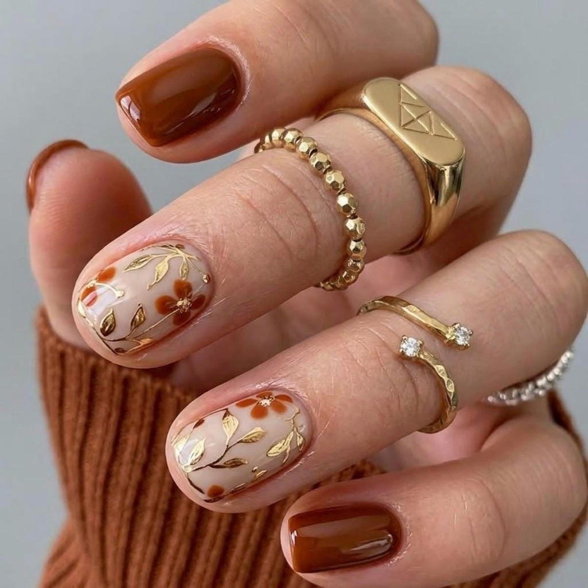 Fall Deep Brown Floral Nails with Sheer Nude Accents and Gold Leaf