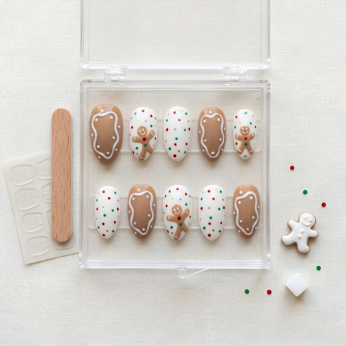 Gingerbread Man Nails With Icing Details and Festive Dots