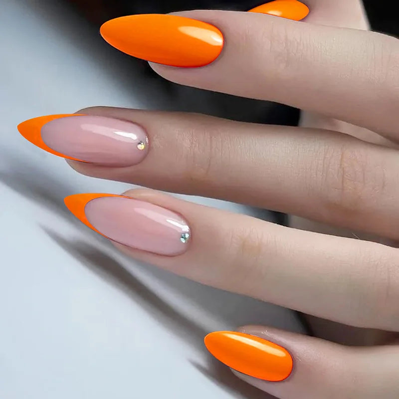 Glossy Pink-Nude and Vivid Orange French Tip Nails with Rhinestone Accents