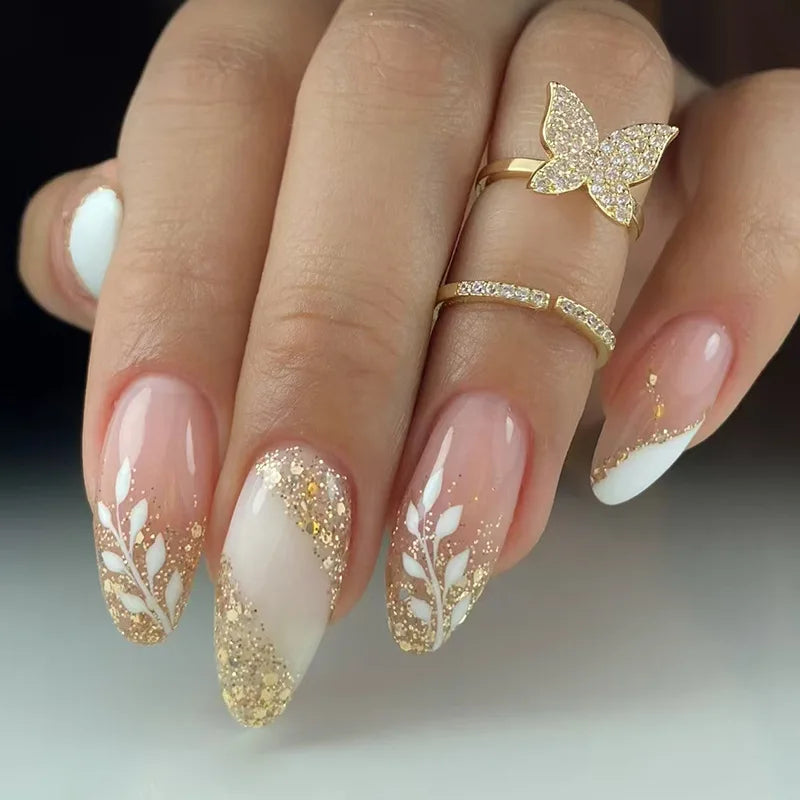 Gold Glitter French Tip Nails With White Leaf Designs