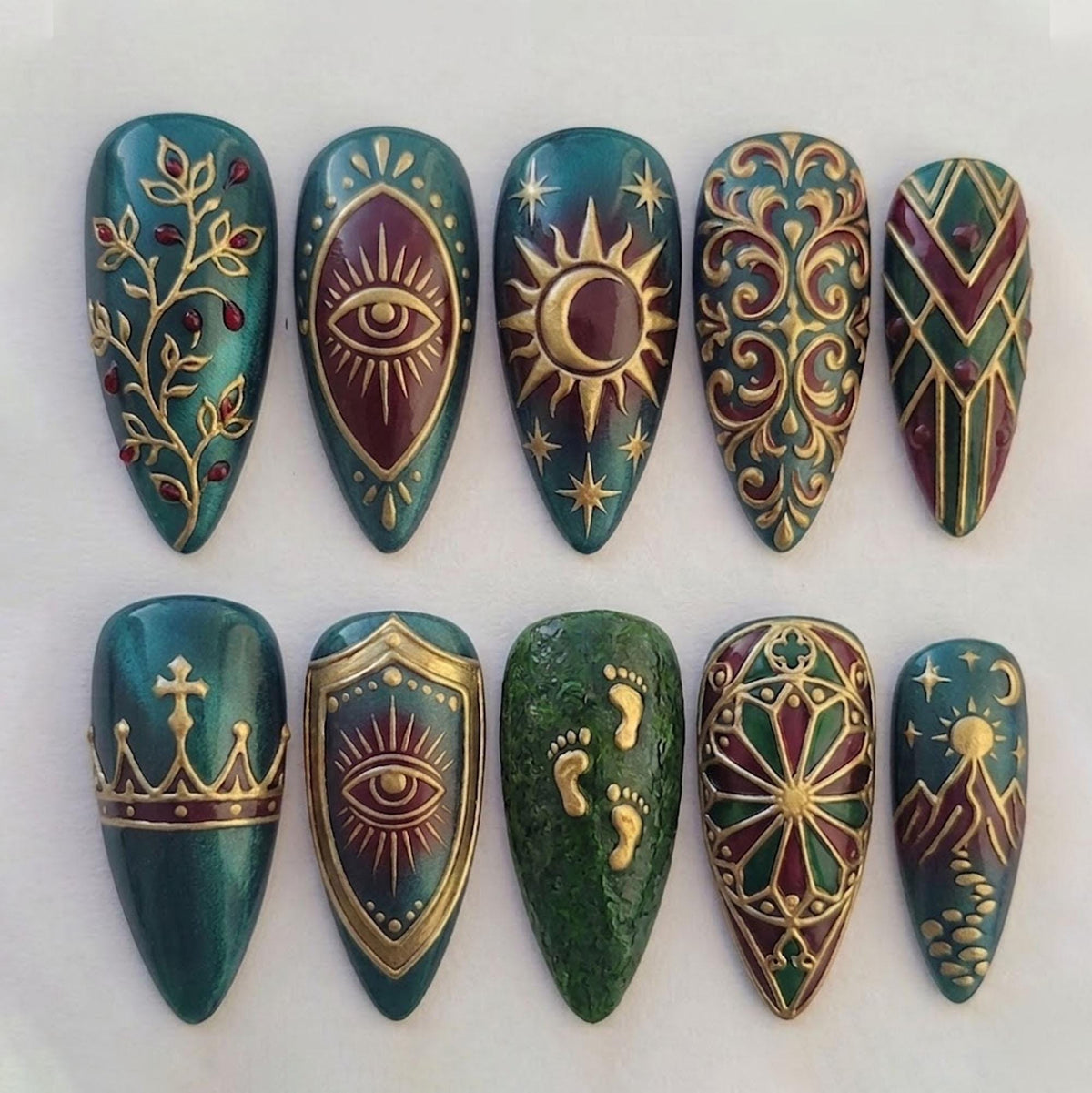 Gothic Celestial Emerald and Burgundy Nails with Ornate Gold Motifs