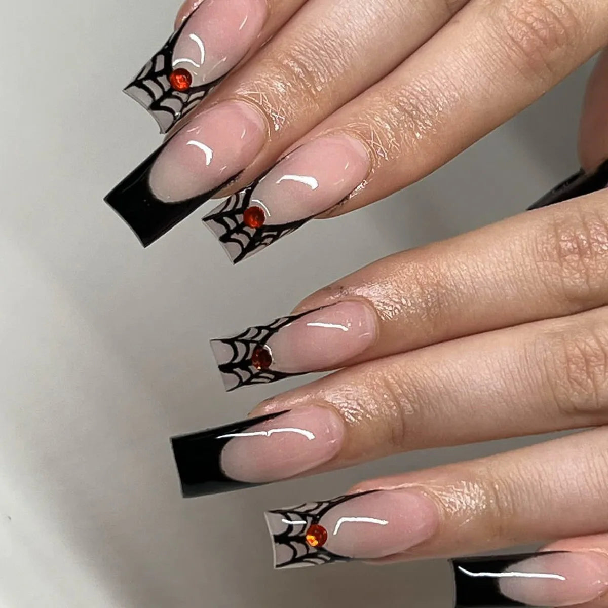 Gothic Halloween Press-On Nails with Black French Tips, Spiderwebs, and Red-Orange Gems