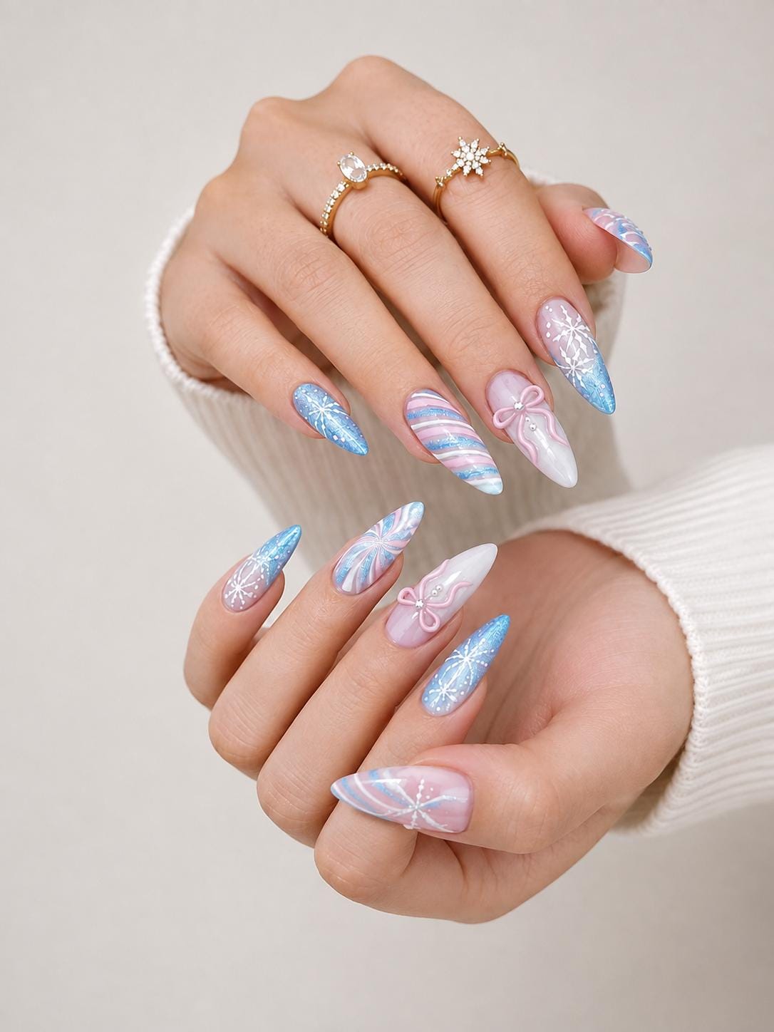 Icy Blue and Pink Winter Nails with Glitter, Snowflakes, and Pearl-Center Bows