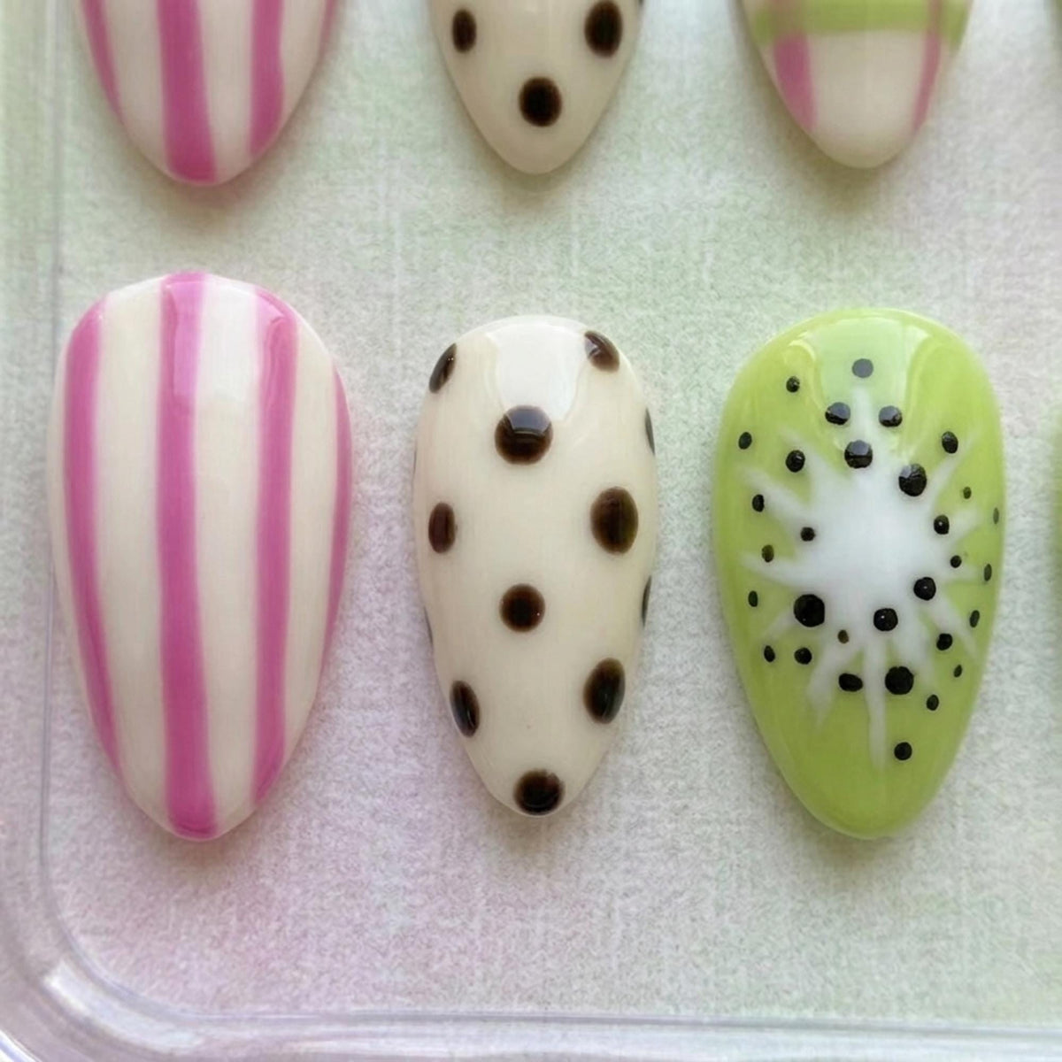 Kiwi-Inspired Fruit Nail Set With Pink Stripes, Plaid, and Polka Dots