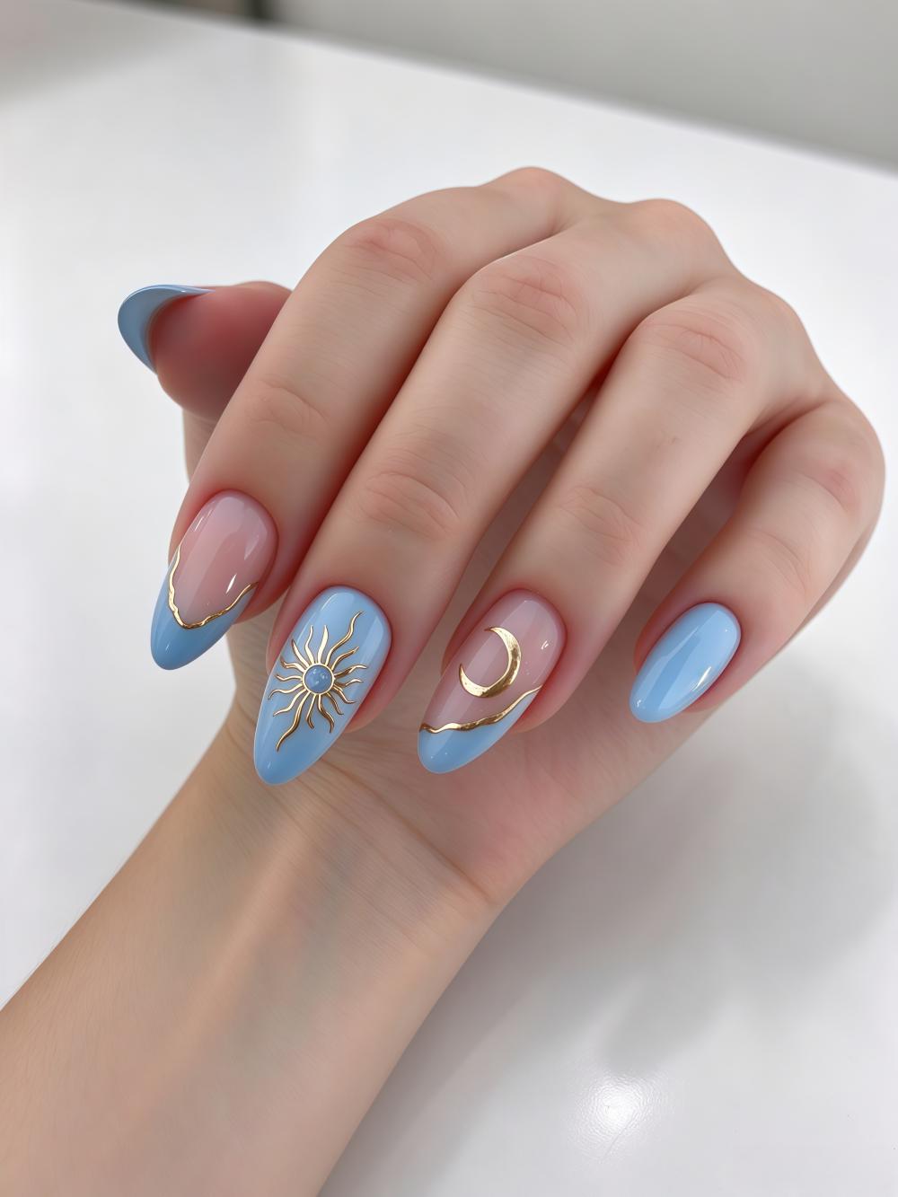 Light Blue and Sheer Pink Nude Celestial Nails with Gold Sun and Moon Details