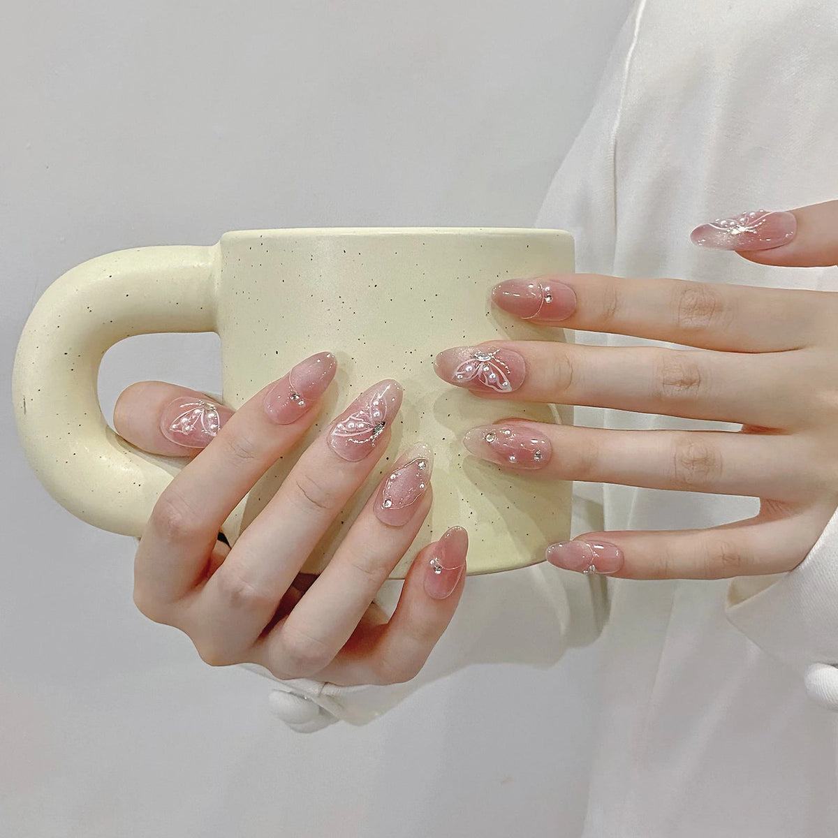 Mauve-Pink Shimmer French Tip Nails With Pearl Accents