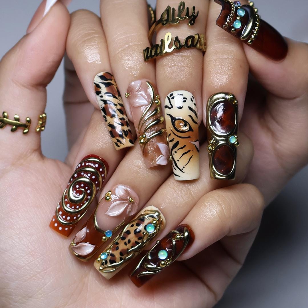Maximalist Fall Animal Print Nails With Gold Frames and Turquoise Stones