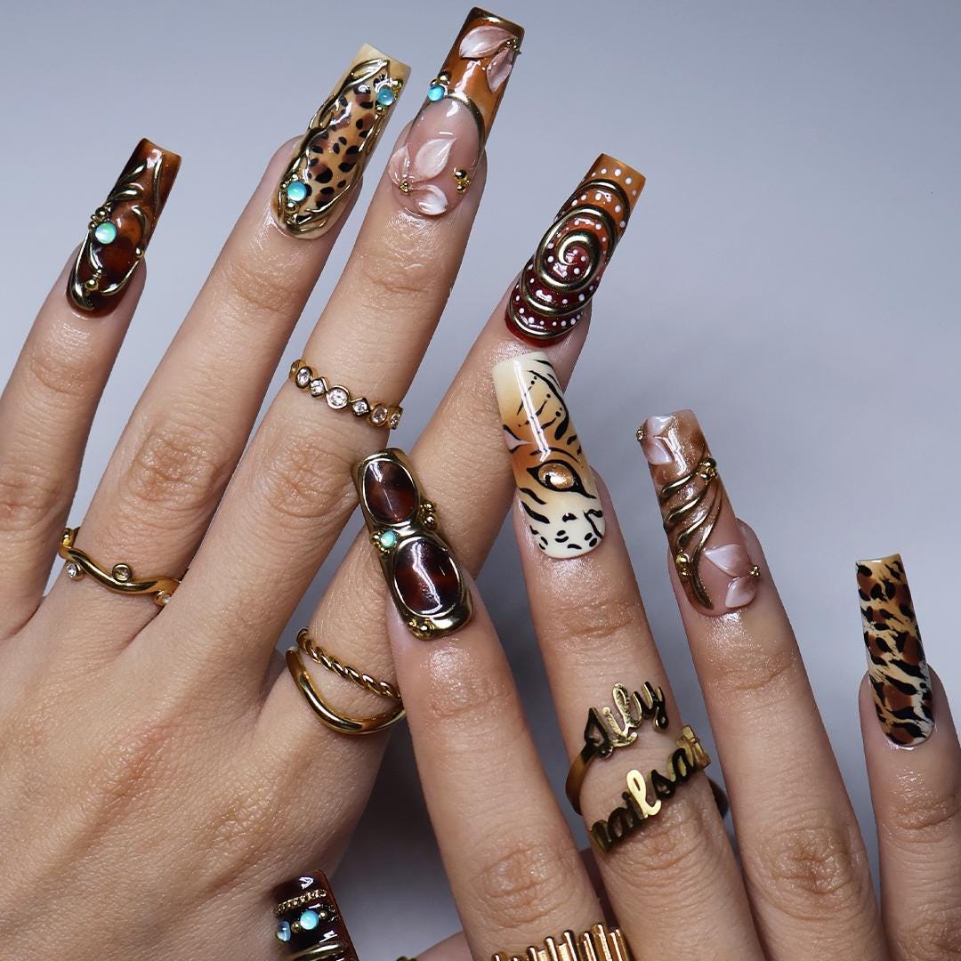 Maximalist Fall Animal Print Nails With Gold Frames and Turquoise Stones