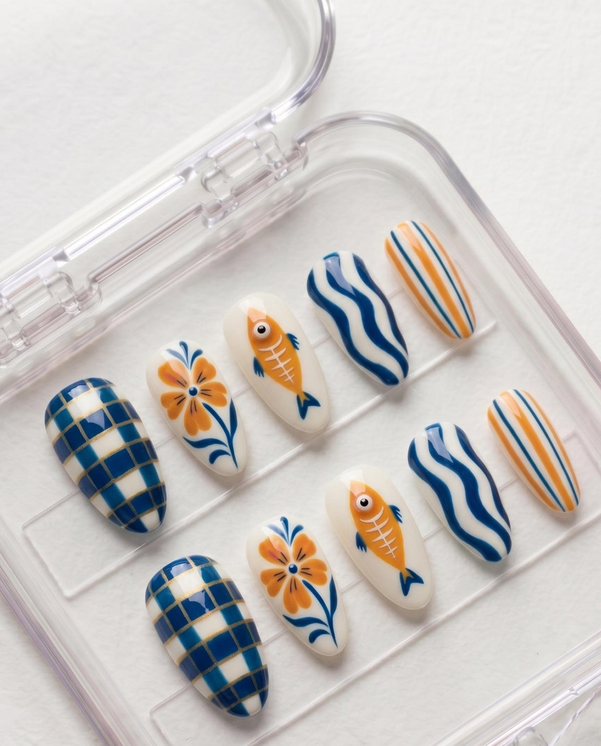 Mediterranean Fish and Floral Press On Nails in Blue, Orange, and Cream