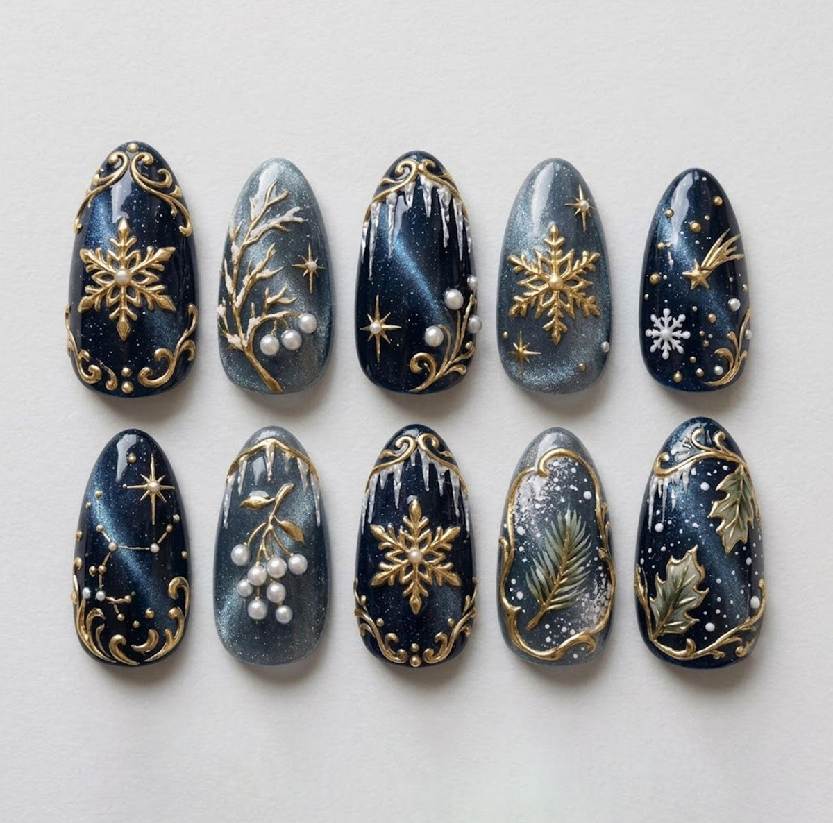 Midnight Navy and Silver Cat Eye Winter Nails with Gold Snowflakes and Pearl Details