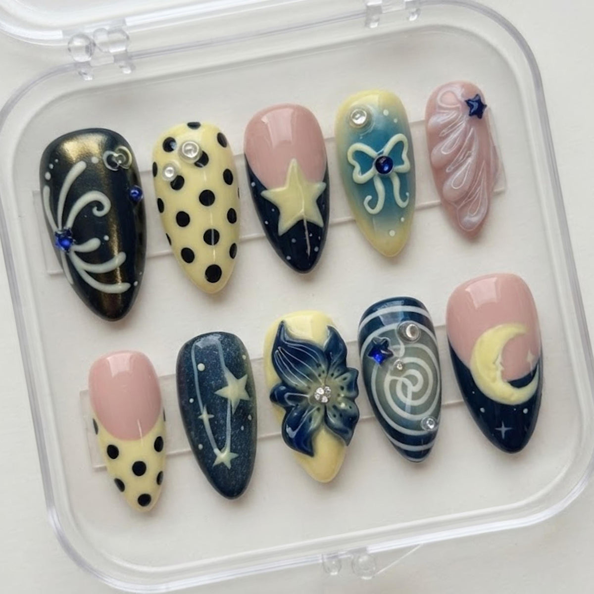 Navy, Pink & Yellow Celestial Nails with Moons, Stars and Blue Flower