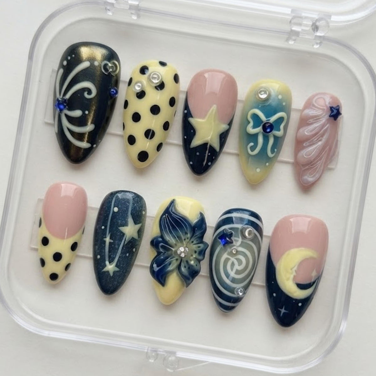 Navy, Pink & Yellow Celestial Nails with Moons, Stars and Blue Flower