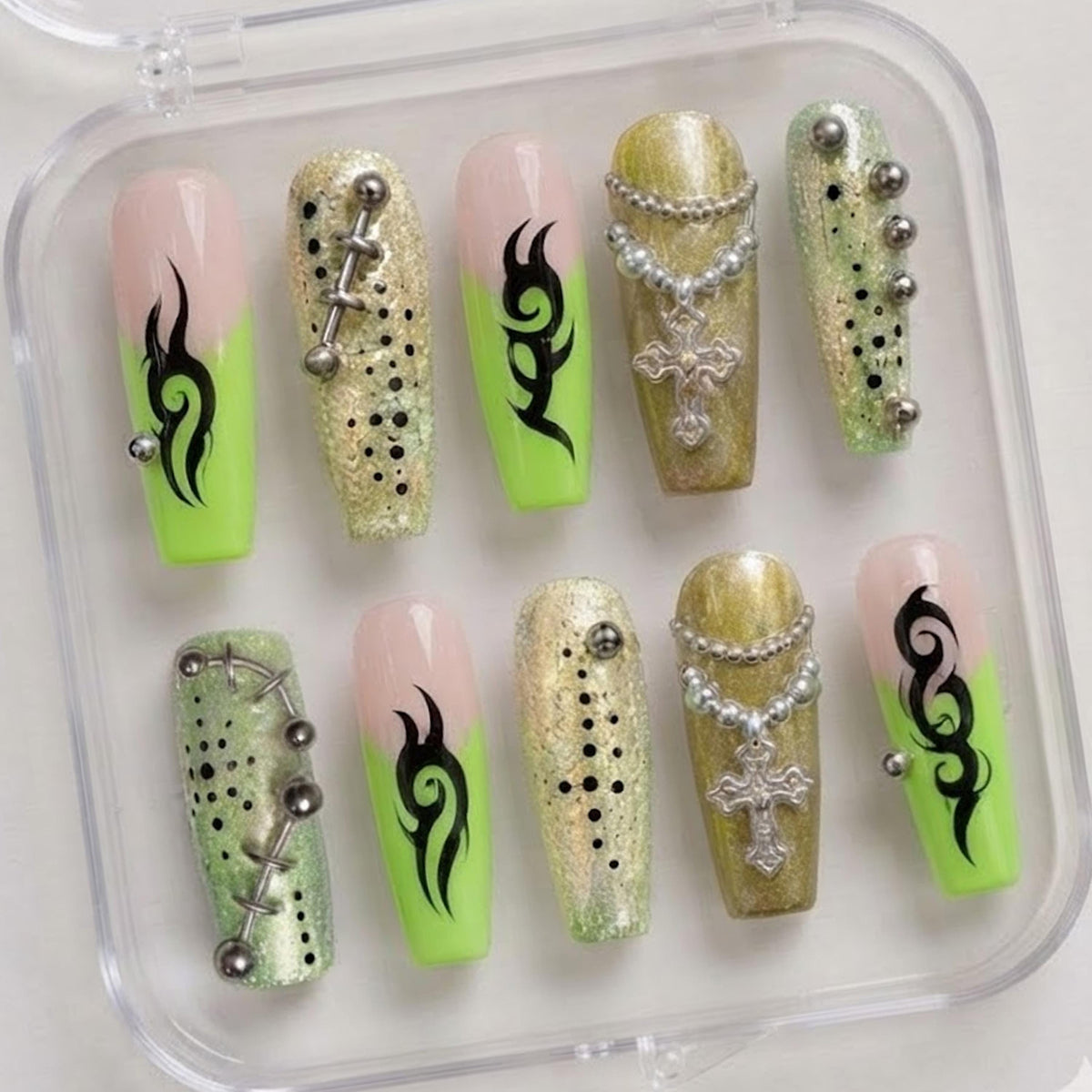 Neon Green French Tip Nails with Black Tribal Flames and Cross Charms