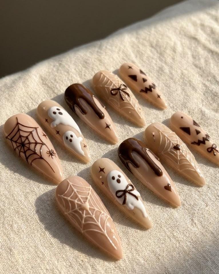 Neutral Brown Halloween Nails With Ghosts, Spiderwebs, Bows, and Jack-O’-Lantern Faces