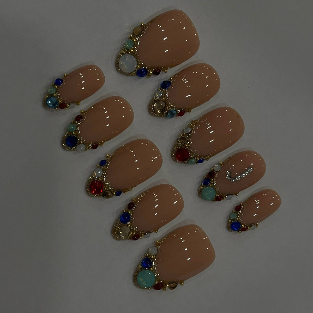 Nude Beige Initial Press-On Nails With Gold Beading and Multicolored Rhinestones