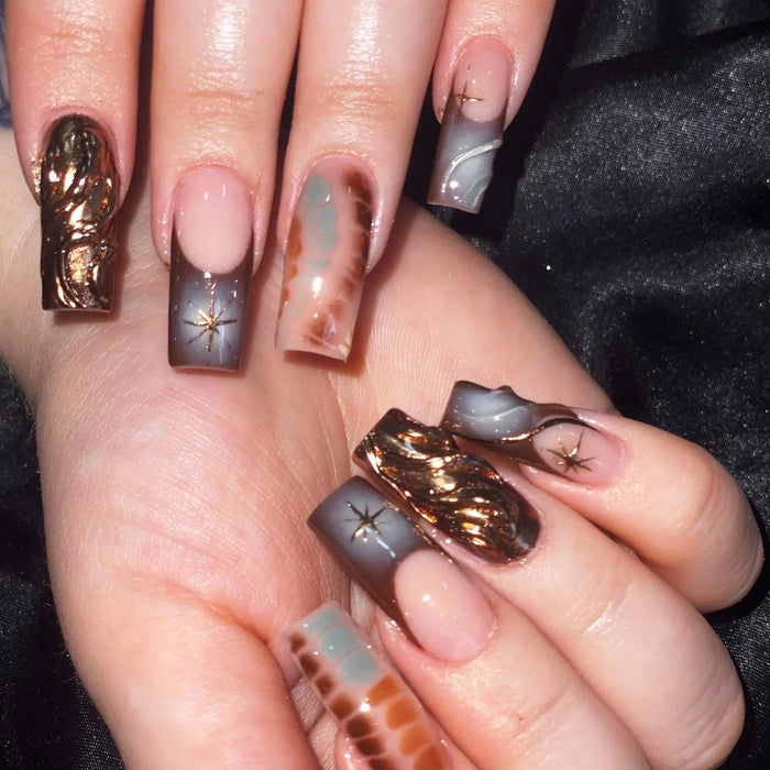 Nude Pink and Smoky Blue Press On Nails with Tortoiseshell, Starbursts, and Bronze-Gold Accents