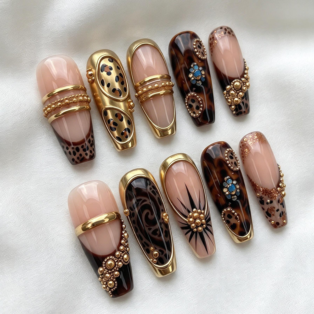 Nude Pink and Tortoiseshell Animal Print Nails with Gold Bands and Jewel Accents