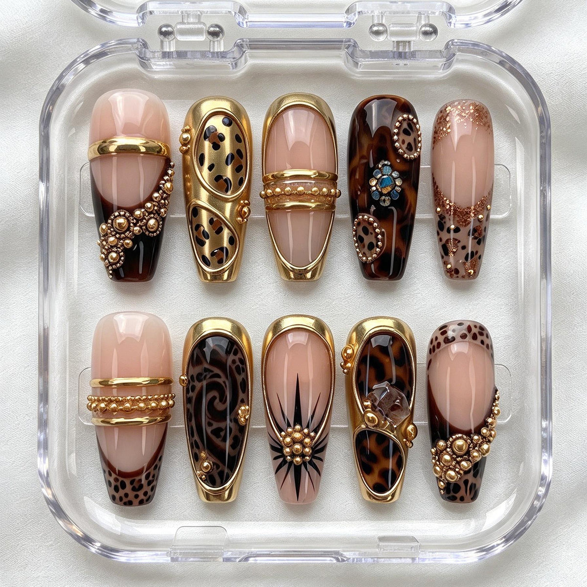 Nude Pink and Tortoiseshell Animal Print Nails with Gold Bands and Jewel Accents