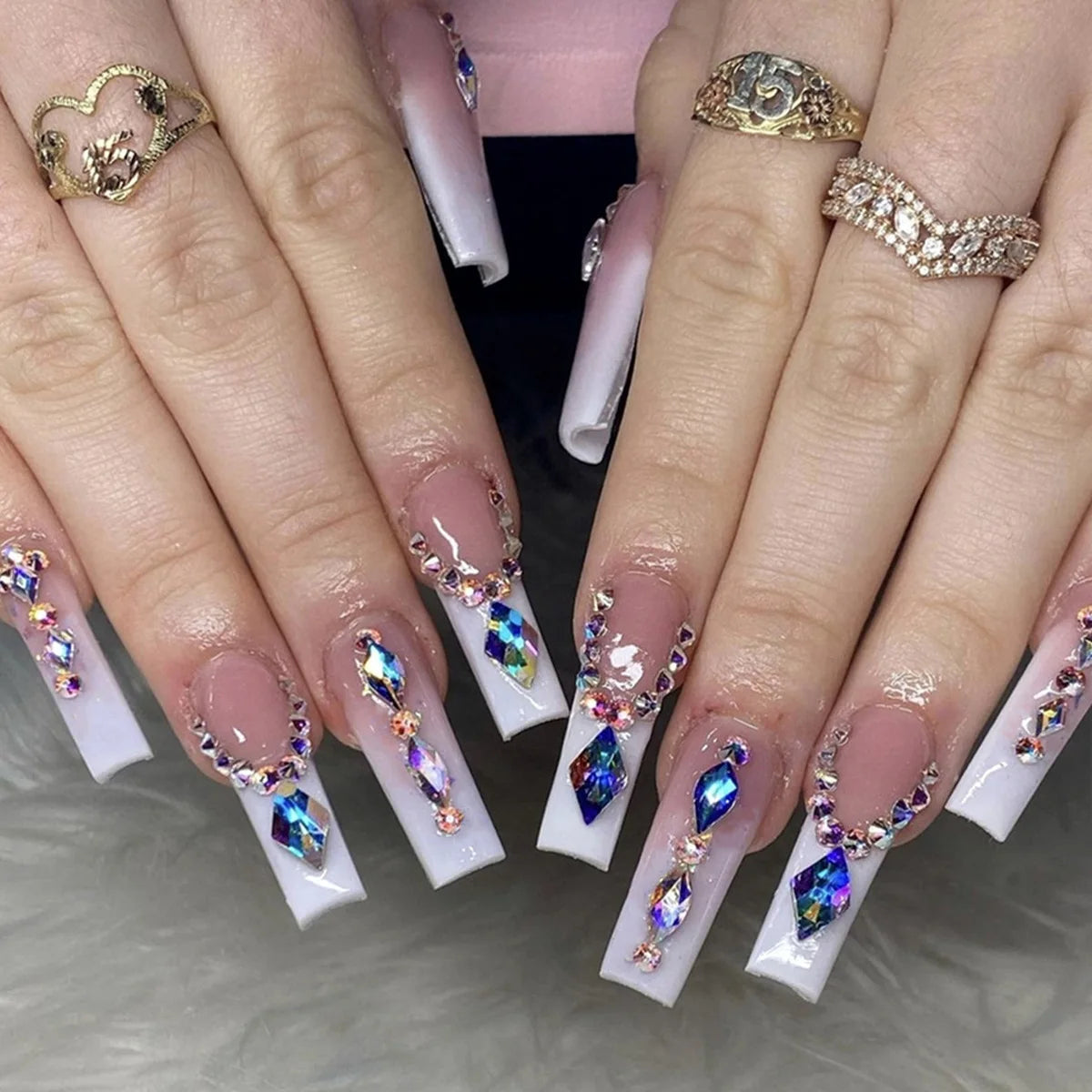 Nude Pink and White French Tip Nails with Blue-Purple Iridescent Gems