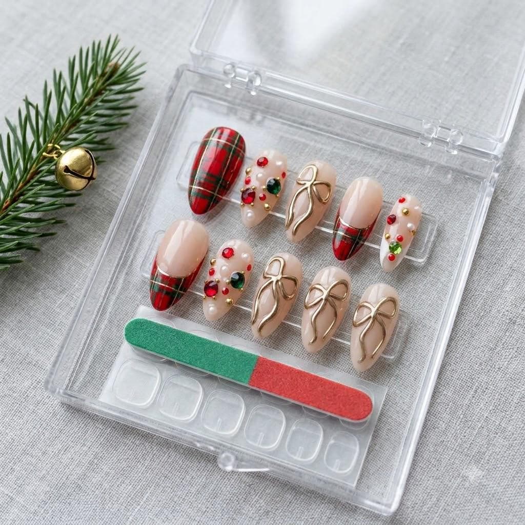 Nude Pink Christmas Nails with Plaid Tips, Gold Bows and Gem Accents
