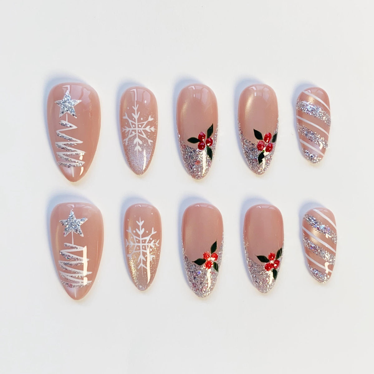 Nude Pink Christmas Nails With Silver Glitter Trees, Snowflakes, and Holly