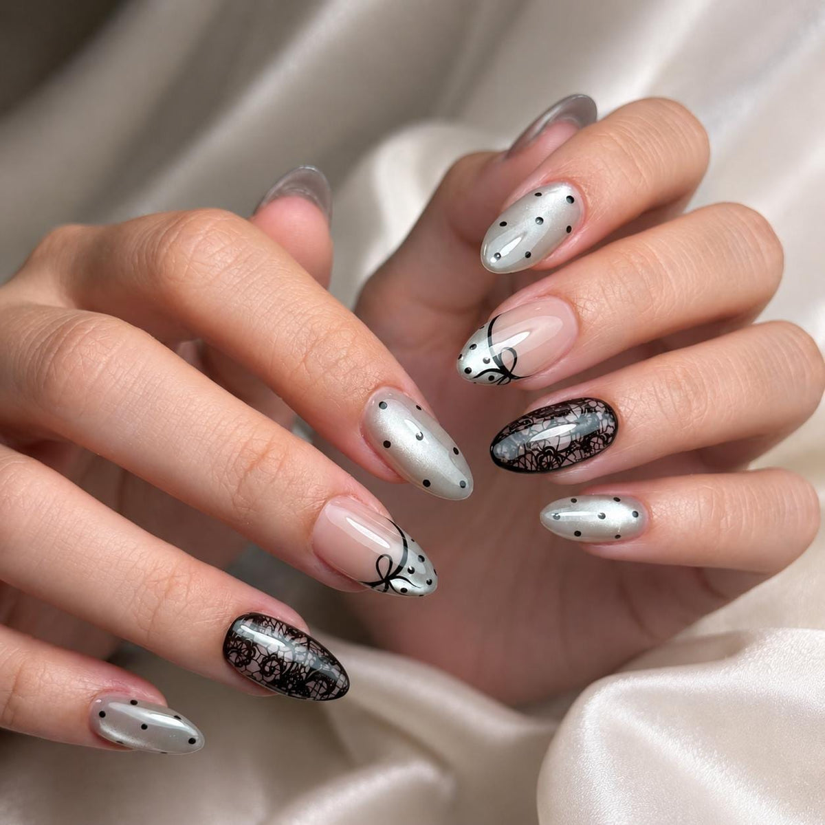 Nude Pink French Tip Nails With Black Polka Dots, Bows, and Lace Details