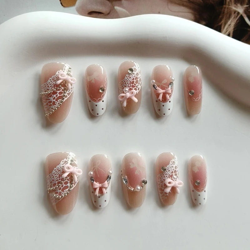 Nude Pink French Tip Nails With White Lace, 3D Bows and Rhinestones