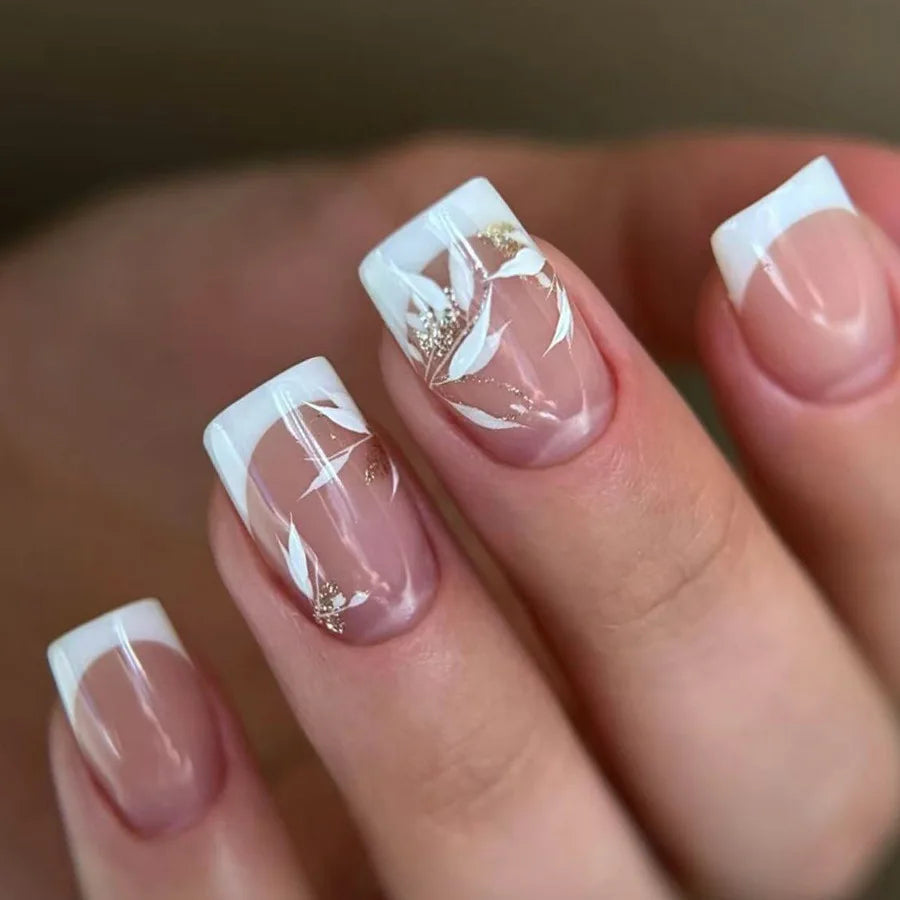 Nude Pink French Tip Nails with White Swirls and Gold Foil