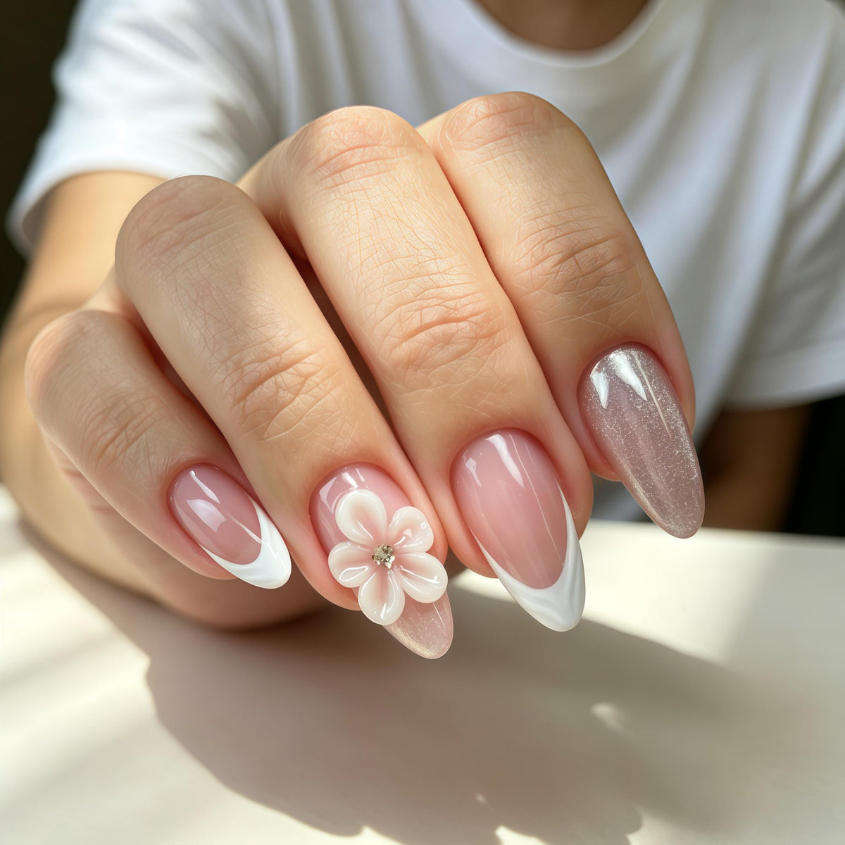 Nude Pink French Tip Wedding Nails with Raised White Flowers and Glitter