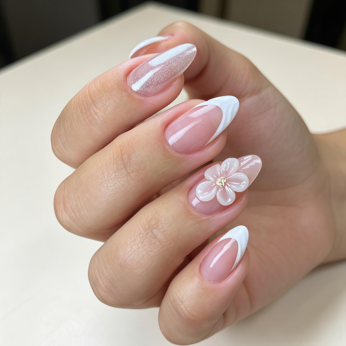 Nude Pink French Tip Wedding Nails with Raised White Flowers and Glitter