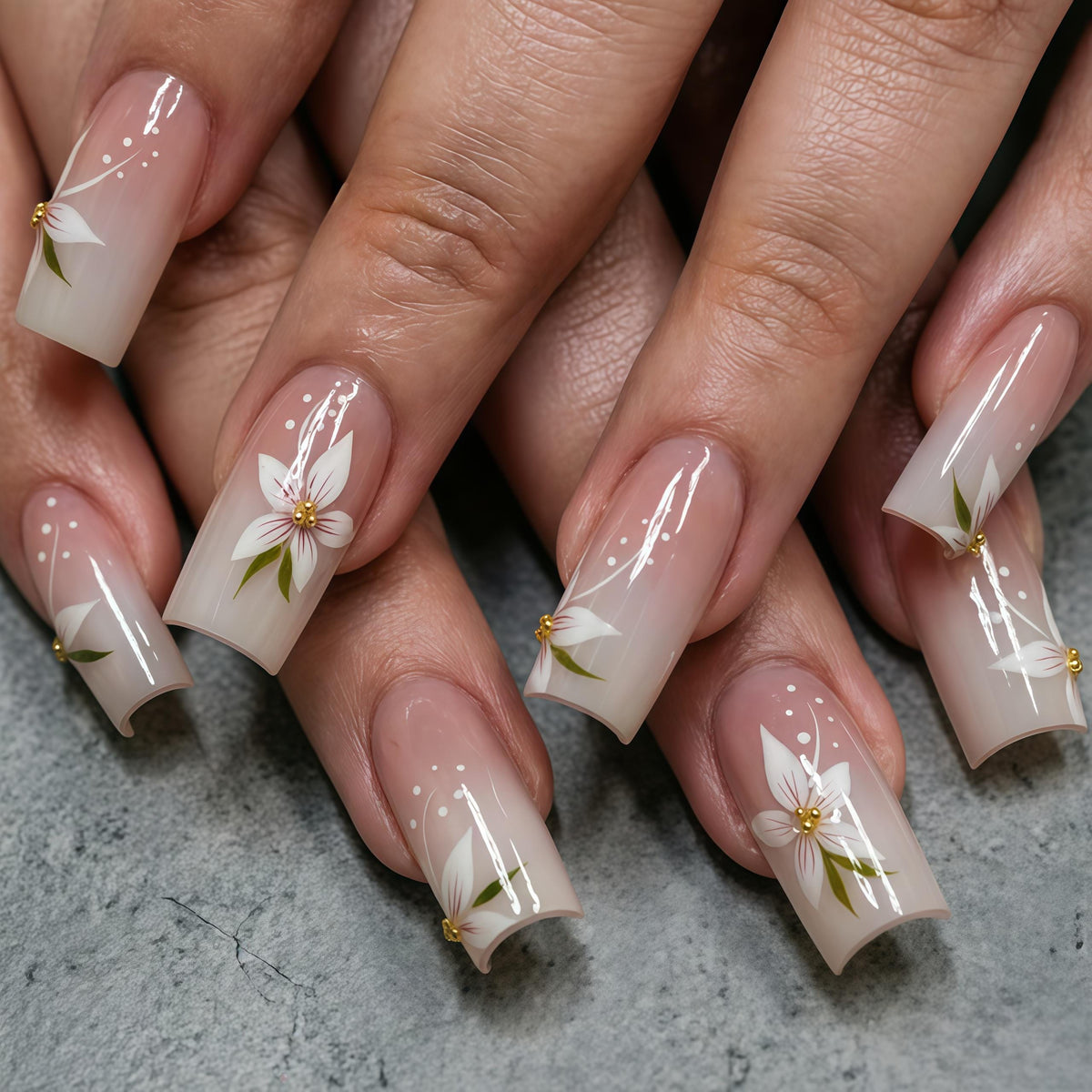 Nude Pink Ombre French Tip Nails With White Flowers and Gold Centers