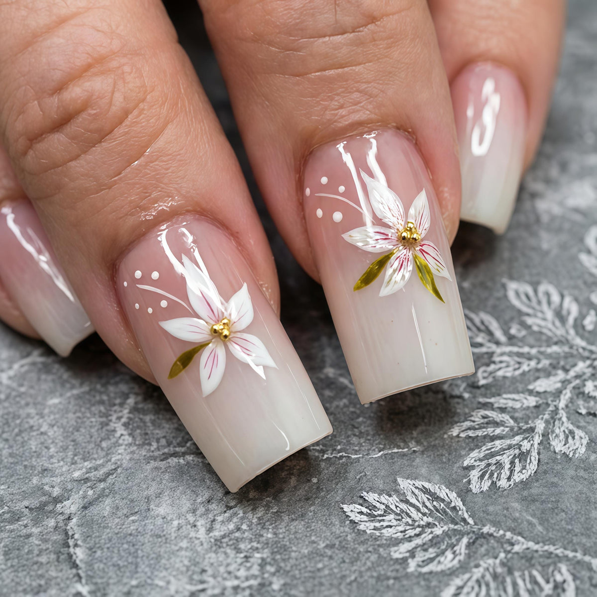 Nude Pink Ombre French Tip Nails With White Flowers and Gold Centers