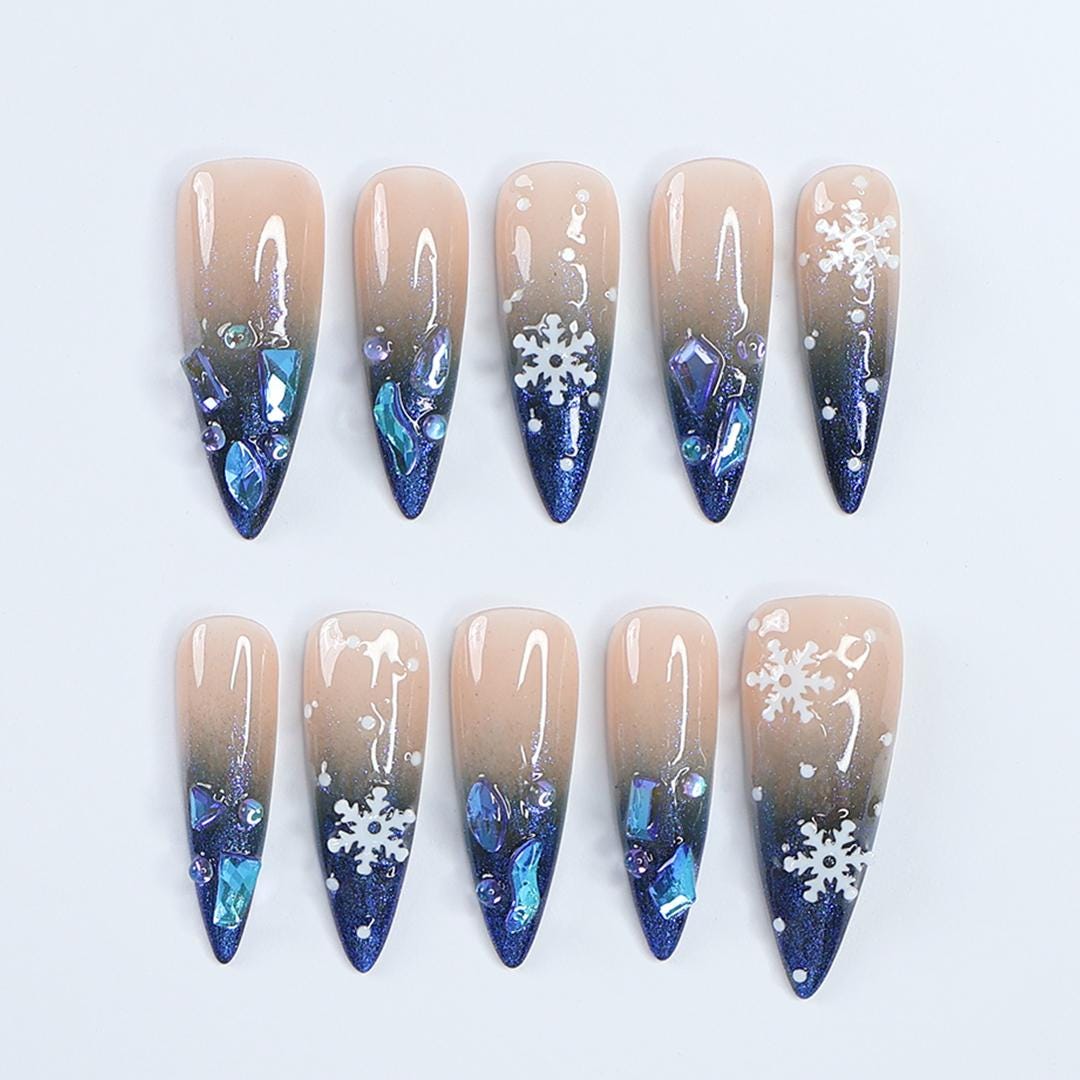 Nude-to-Navy Christmas Snowflake Press-On Nails With Blue Gems