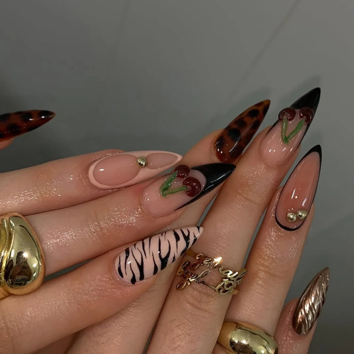 Nude Zebra French Tip Nails with Cherries and Gold Accents
