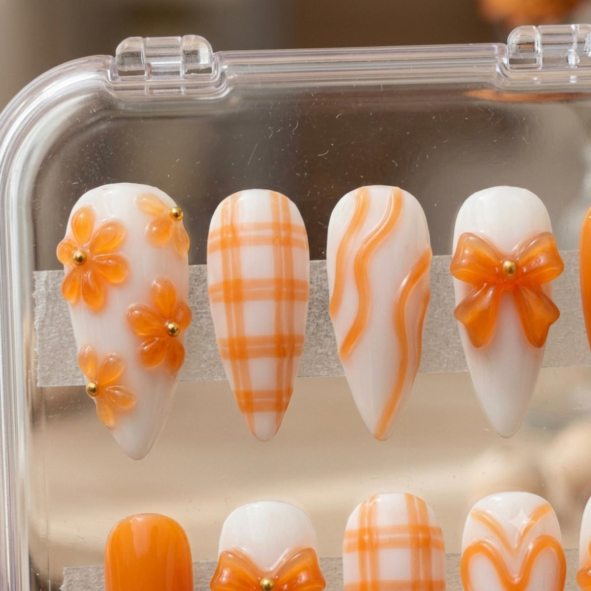 Orange 3D Flower and Bow Press On Nails with Plaid and Swirls