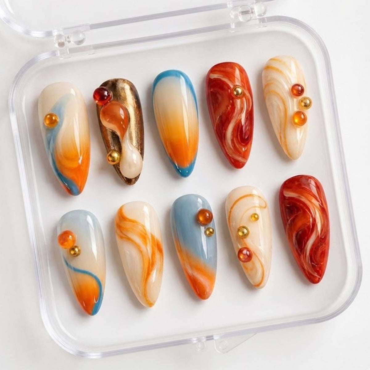 Orange and Icy Blue Jelly Nails with Amber Swirls and 3D Bead Accents