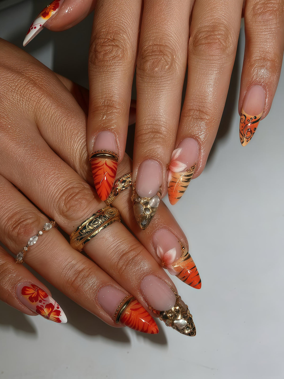 Orange Tiger Stripe Nails With Raised Flowers and Gold-Tone Stone Charms