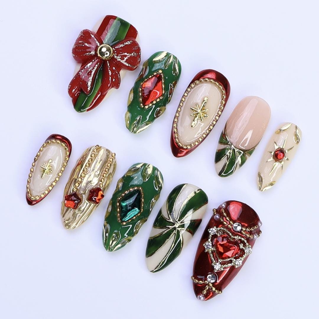 Ornate Christmas Press-On Nails With Red Bow, Emerald Gems and Gold Starbursts