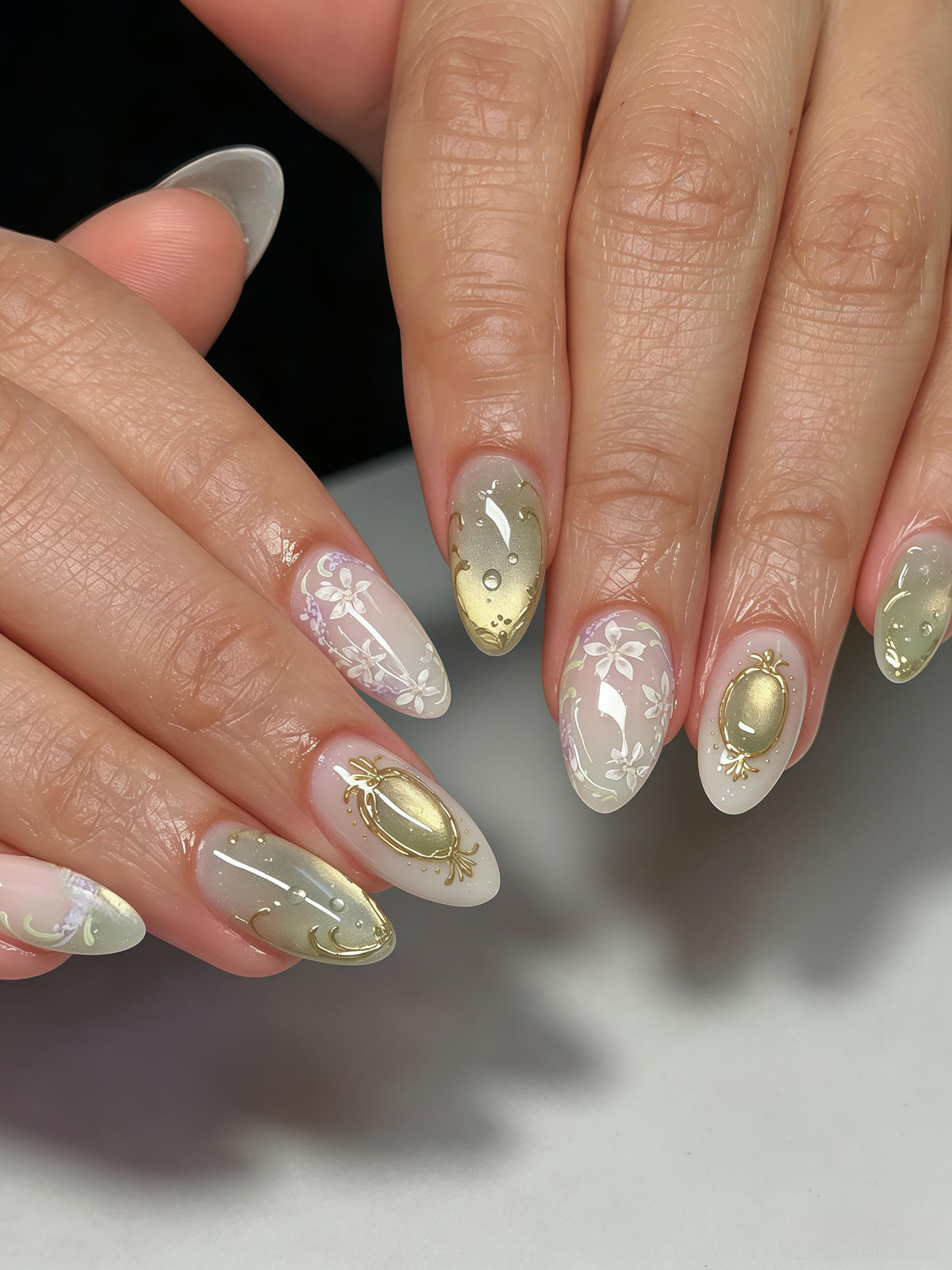 Pale Green and Lilac Floral Nails with Gold Foil Accents