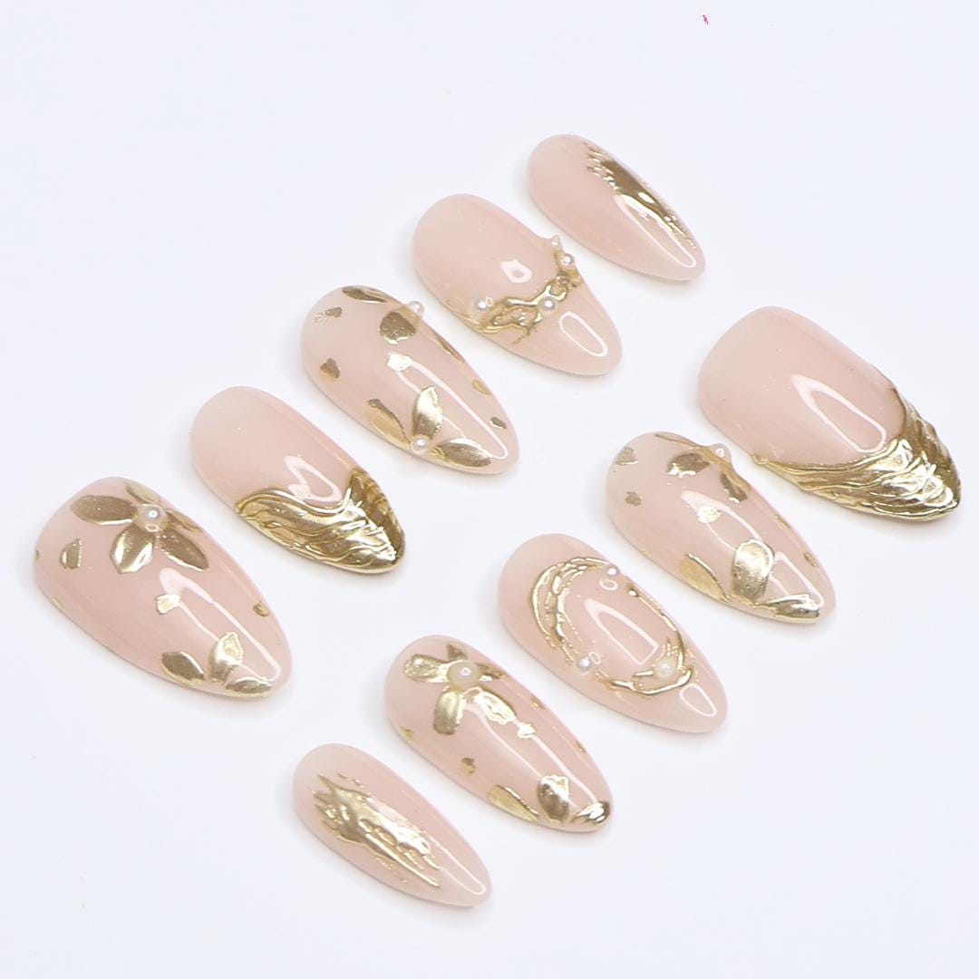 Pale Nude Pink Nails with Sculpted Gold Floral Details and Pearl Accents