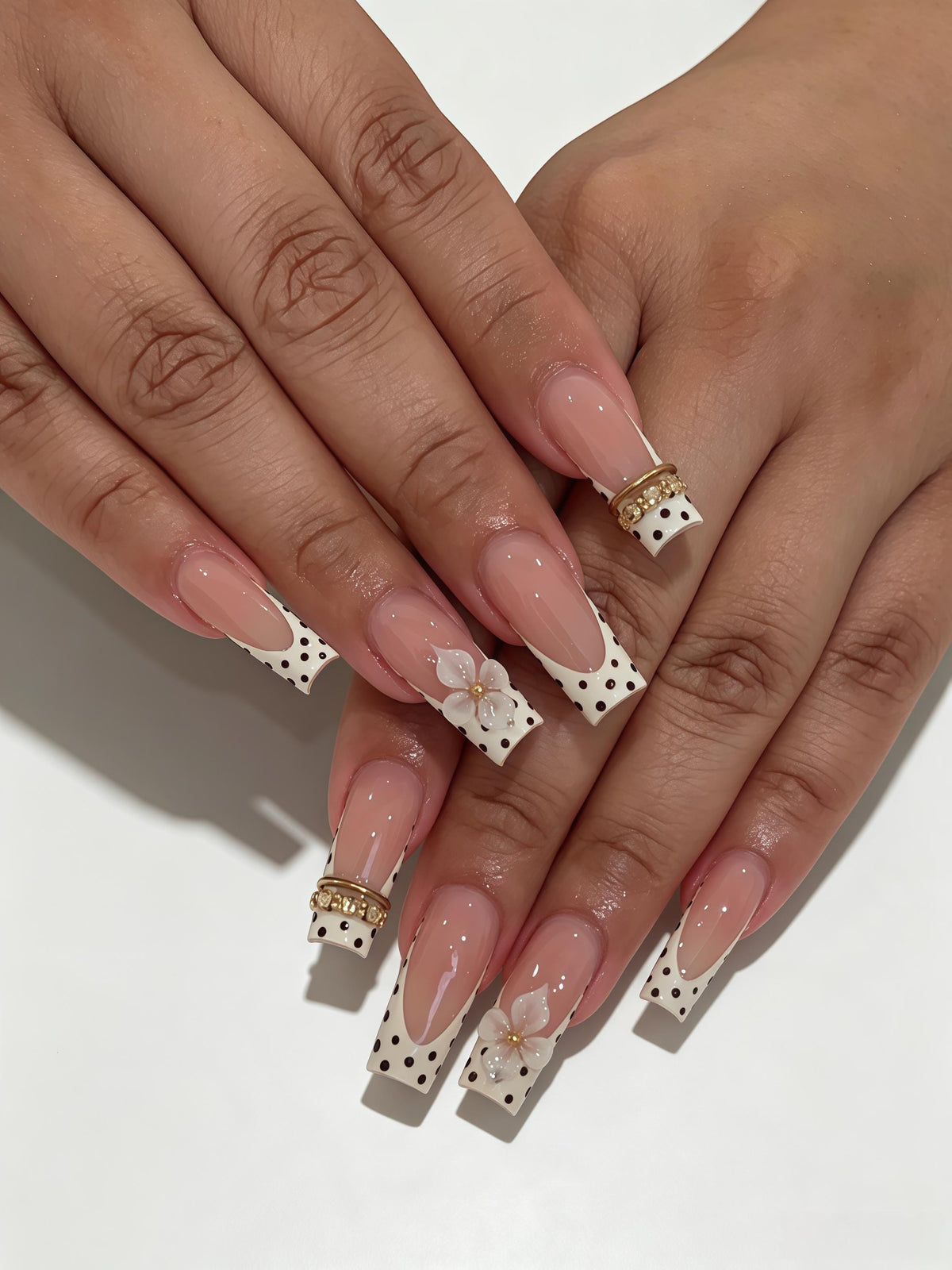 Pale Pink Polka Dot French Tip Nails with 3D Flowers and Gold Accents