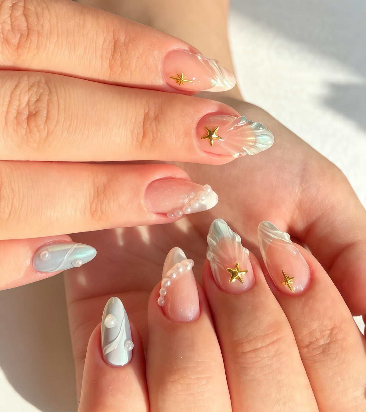 Pastel Blue and Pink Seashell Nails with Pearl Accents and Gold Starfish Charms