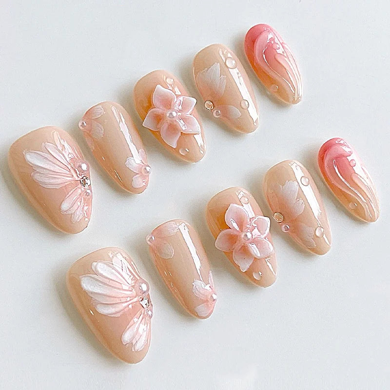 Peach Nude Nails With Pink Butterflies, Coral Gradient French Tips and Pearl Details