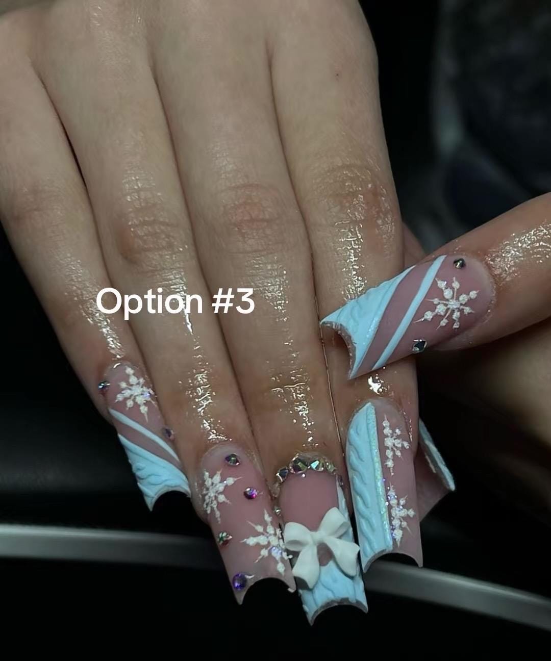 Pink and Mauve Christmas & Winter Nail Designs with Bows, Snowflakes and Gold Accents
