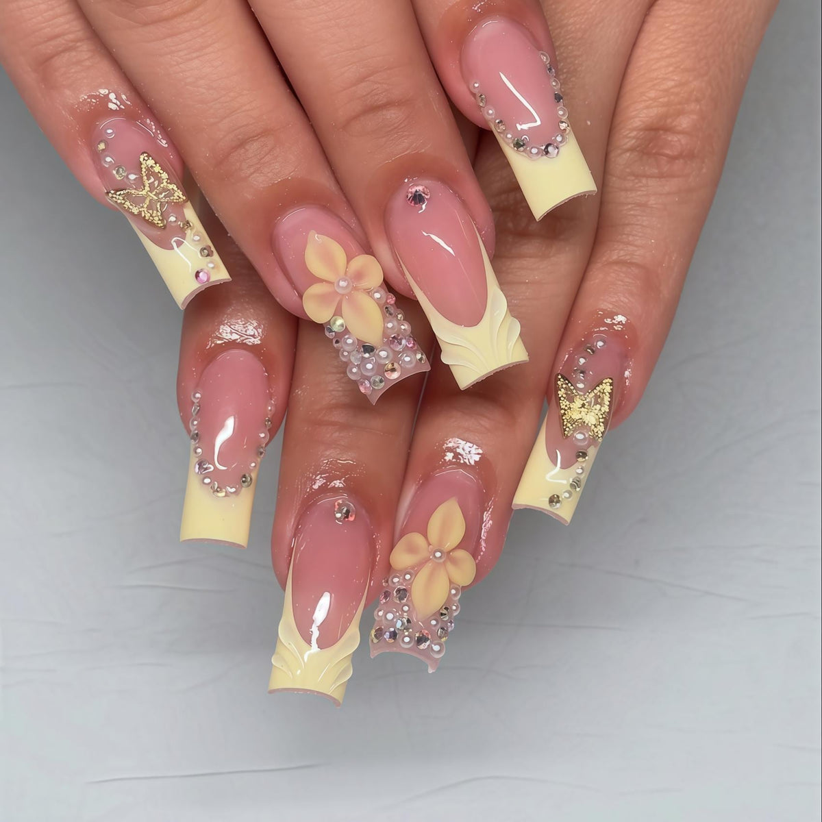 Pink and Pale Yellow French Tip Press-On Nails with Flowers, Butterflies and Rhinestones