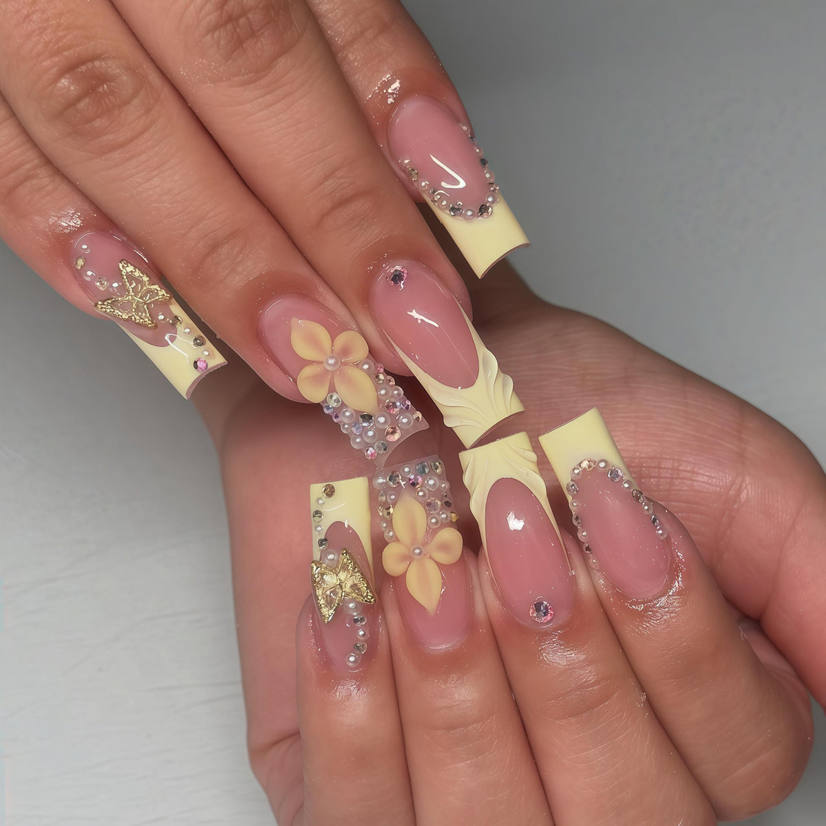 Pink and Pale Yellow French Tip Press-On Nails with Flowers, Butterflies and Rhinestones